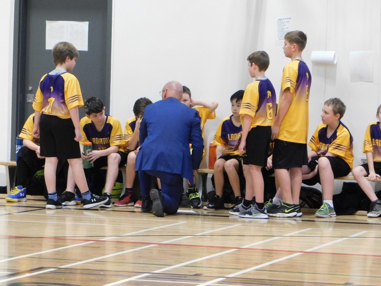 St Gregory the Great Basketball coach talking to team